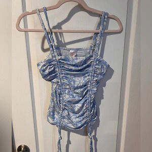 No boundaries size medium, ( 7–9) blue floral tank top with side strings.
